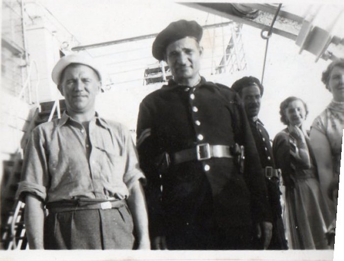 John Edward and Policeman, Port Said, Egypt. 10 Nov 1955. Frances far right