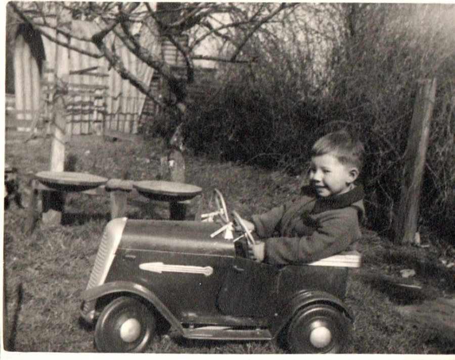 John in car, aged 3 years. Welling, Kent