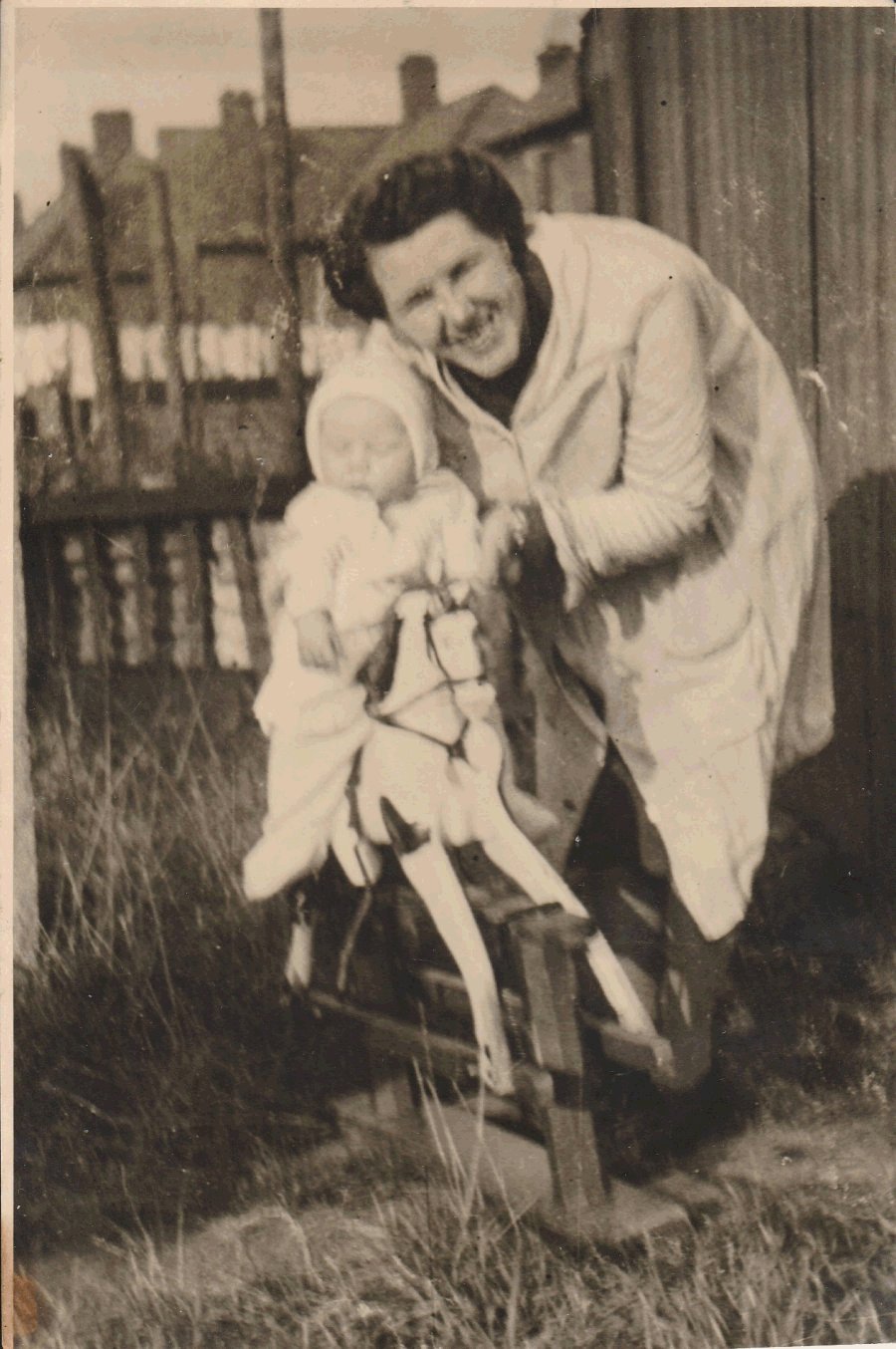 Baby John Olsen and Frances Olsen on rocking horse. London 1947