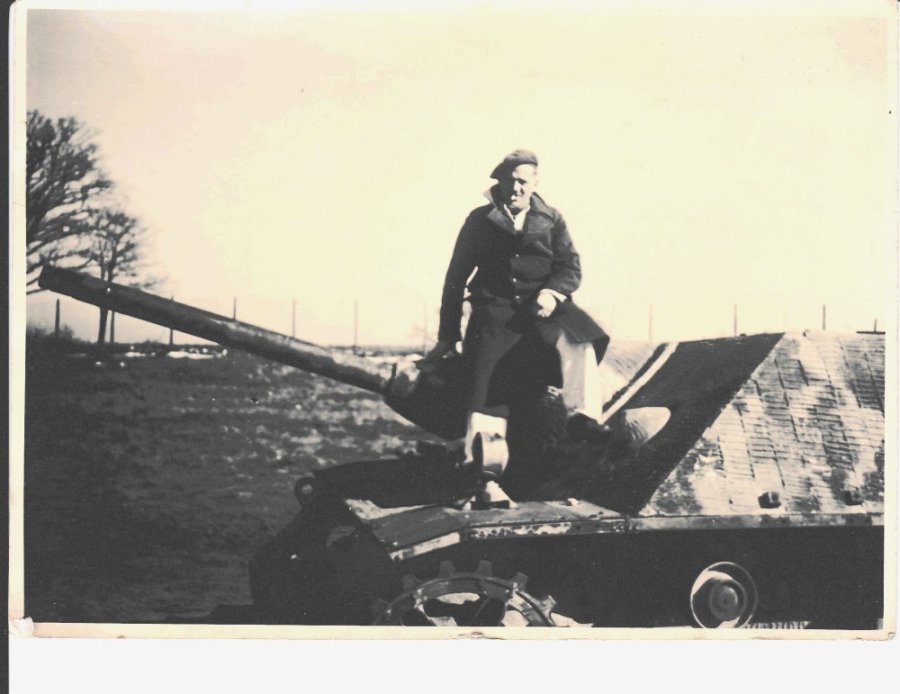 John Edward Olsen on a tank